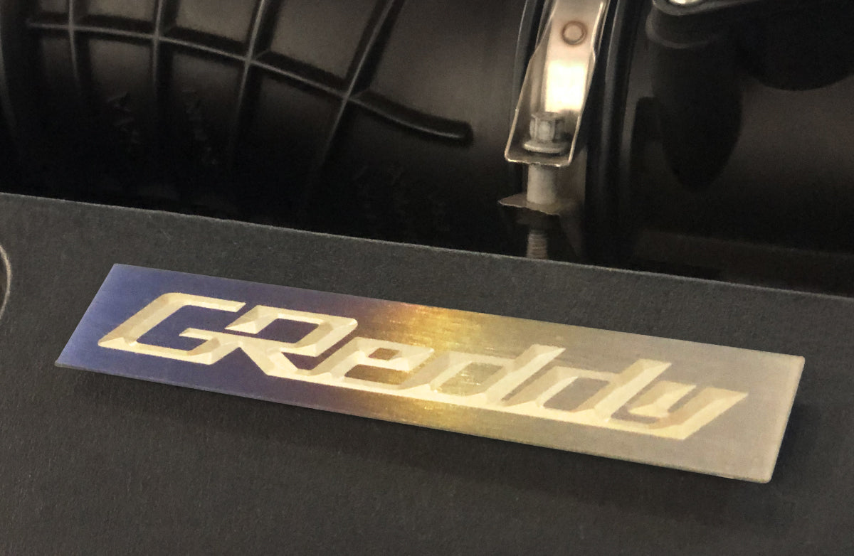 Optional Titanium GReddy Emblem - (105x20mm)